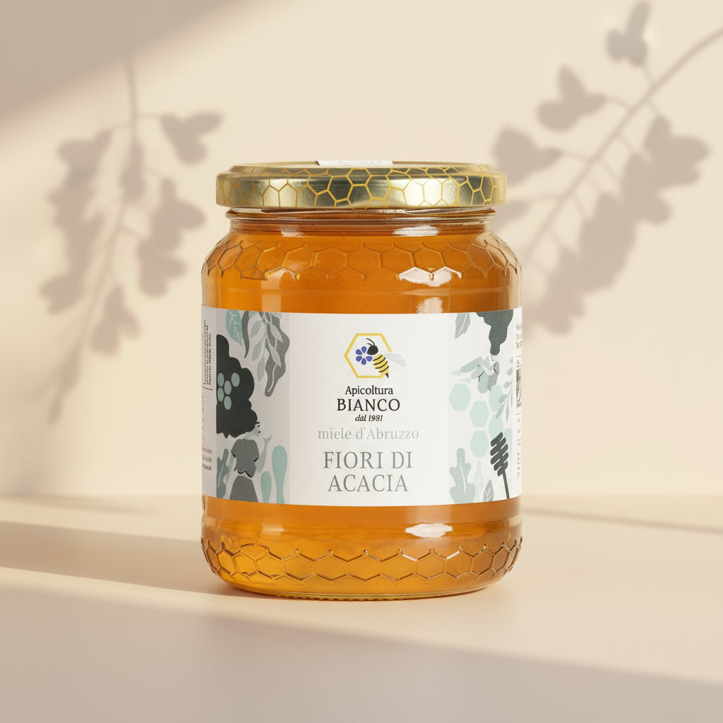 Jar of acacia honey with a white label on a white background